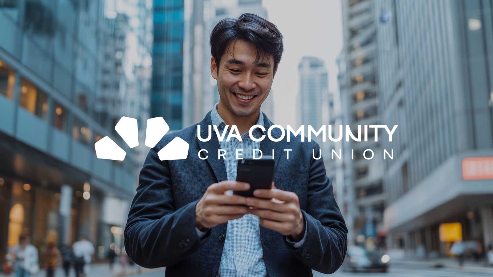 Man outside smiling at hos phone with UVAC logo