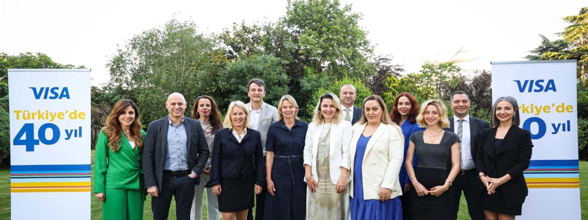 A group of Visa employees pose for a picture while celebrating Visa’s 40 years in Turkiye.