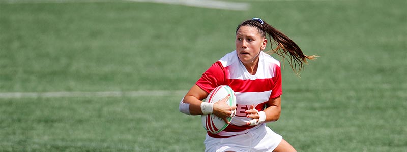 Abby Gustaitis playing rugby