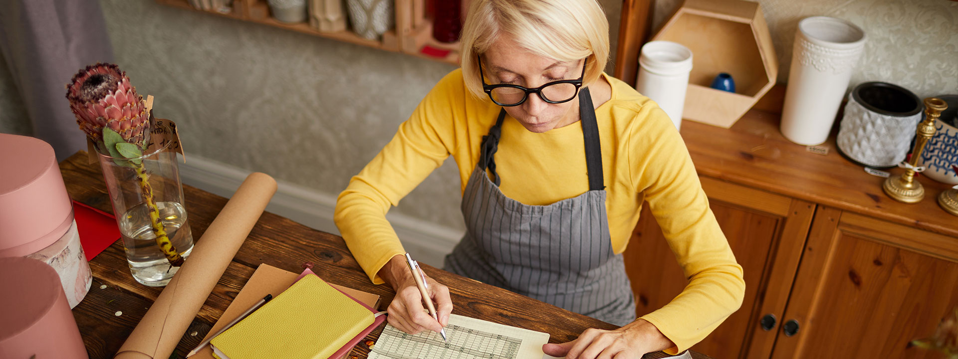 Small business owner looking over finances.