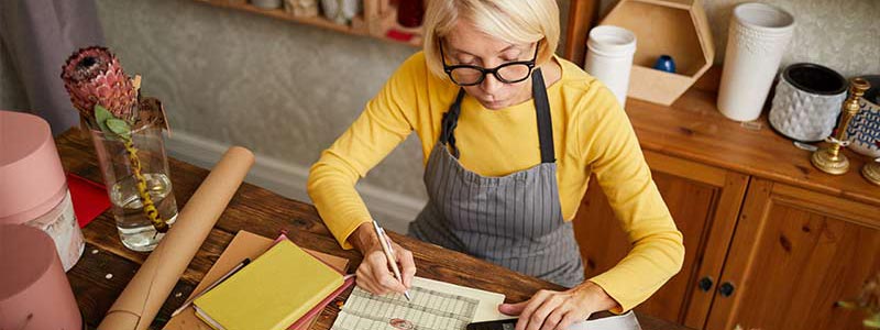 Small business owner looking over finances.