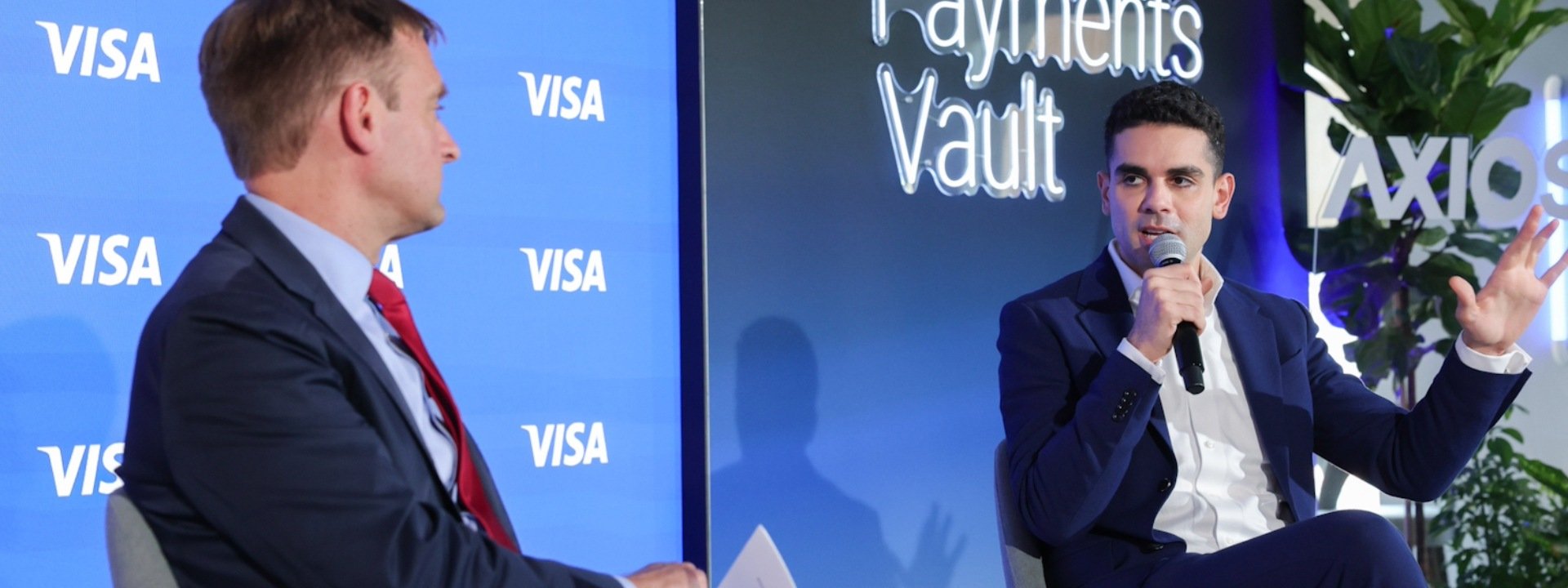 Axios Publisher Nicholas Johnston and Visa's Michael Jabbara talk on stage at the Visa Payments Vault, D.C.