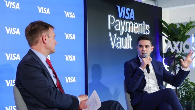 Axios Publisher Nicholas Johnston and Visa's Michael Jabbara talk on stage at the Visa Payments Vault, D.C.