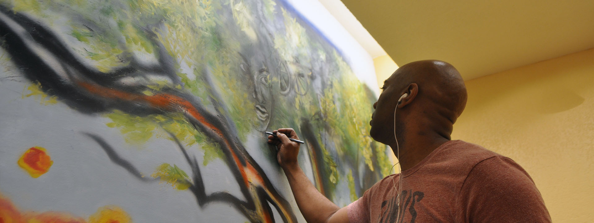 Artist Corey Barksdale paints in his studio