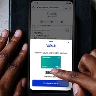 Person interacting with their phone screen to verify identity. Visa logo can be seen on interface and digital card.
