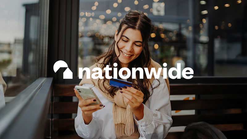 Nationwide Building Society logo overlay on decorative image of a woman holding credit card and phone
