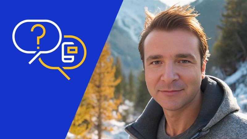 Giacomo Biggiero looks at the camera, standing in front of a snowy mountain scene.