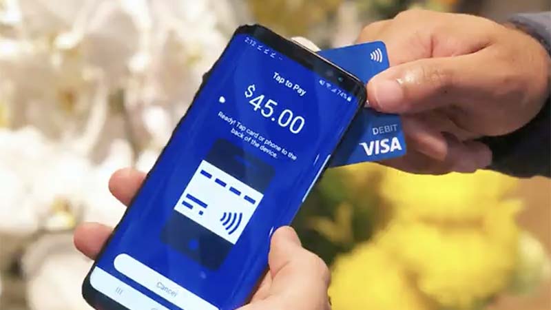 Tap to phone transaction between a card and a phone.