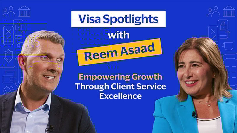 Man and woman smiling against a blue background. Text: 'Visa Spotlights with Reem Asaad: Empowering Growth Through Client Service Excellence.'