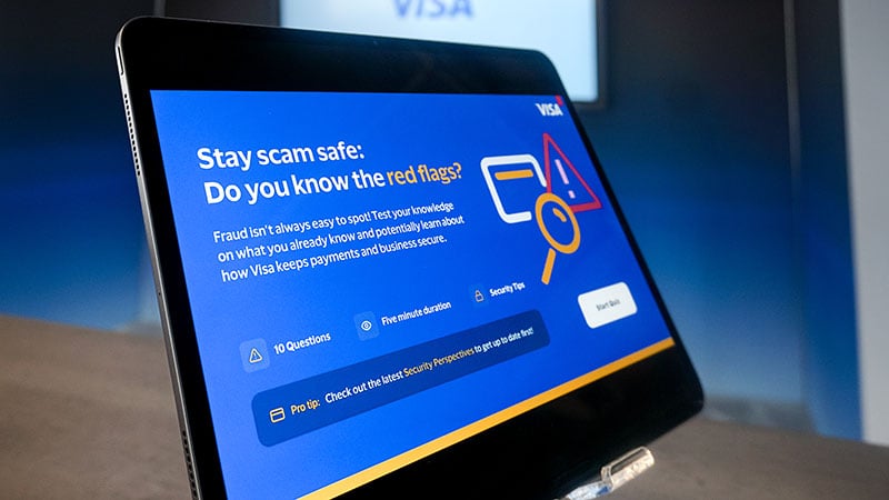 Tablet screen displaying a Stay Scam Safe quiz.